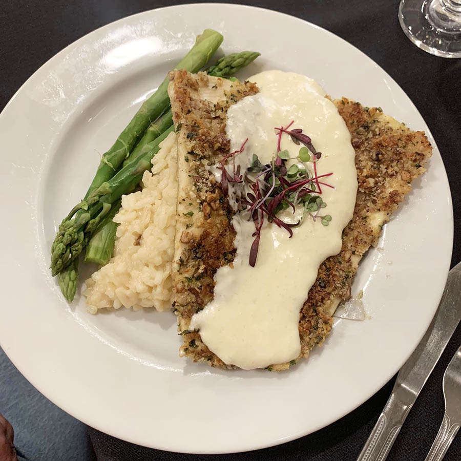 Savor the flavors of asparagus and rice, perfectly complemented by herb breaded fish. A culinary delight awaits!