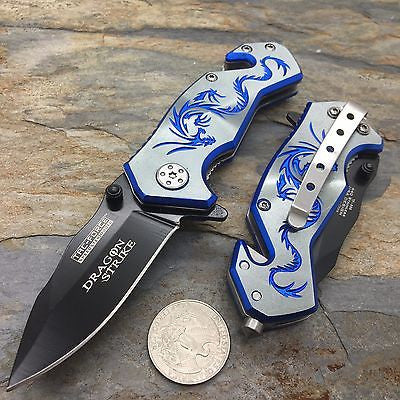 Dragon Strike folding pocketknife with a blue dragon design on the handle, shown open and closed next to a quarter for scale on a stone surface.